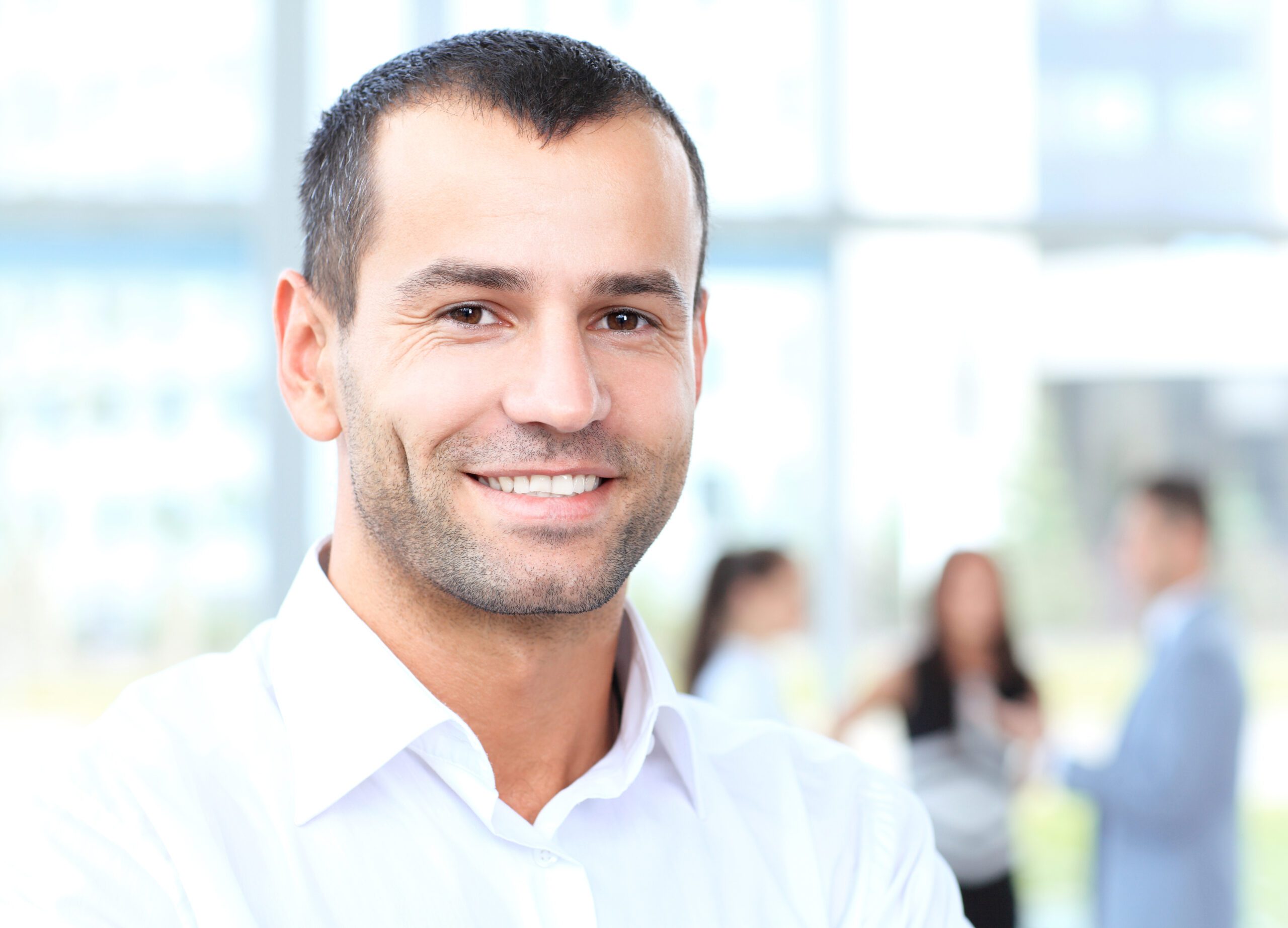 Businessman with colleagues in the background